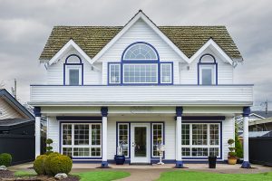 A white house with a variety of window styles